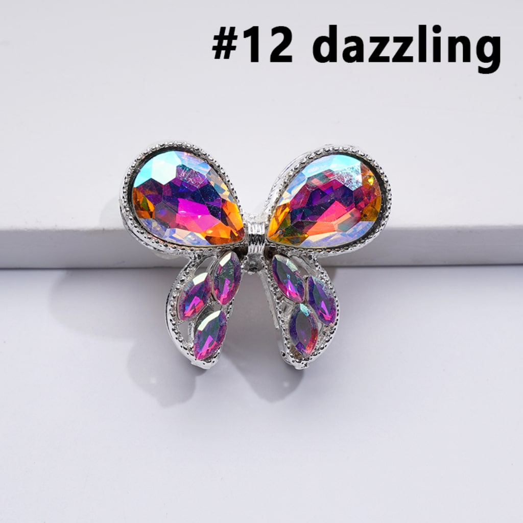 A collection of silver alloy bowknots with colorful shiny rhinestones beads, in various colors.