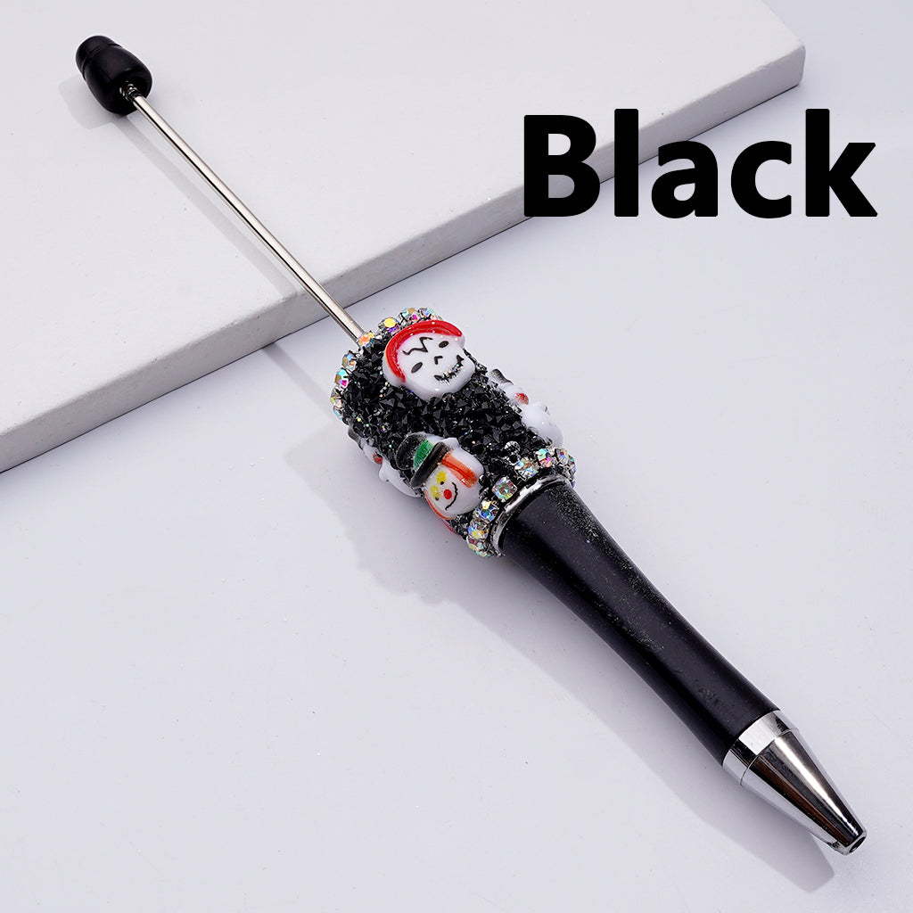 Black pen with decorative snowman top on a white background
