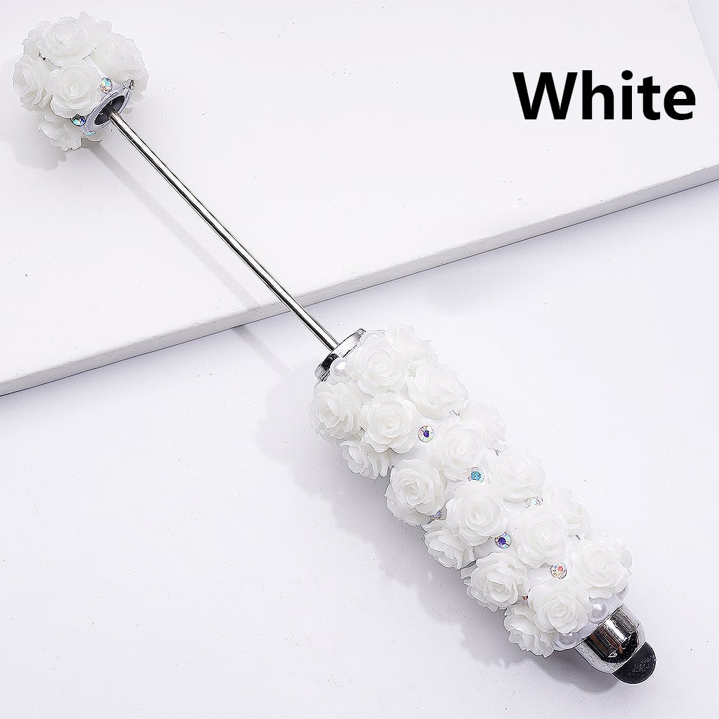 White floral object with rhinestones on a white background