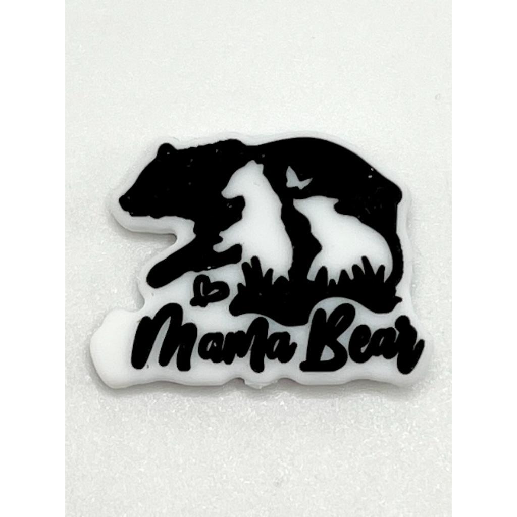 A silicone bead featuring a silhouette of a bear with a cub and the text 'Mama Bear' on it, primarily in black and white colors.