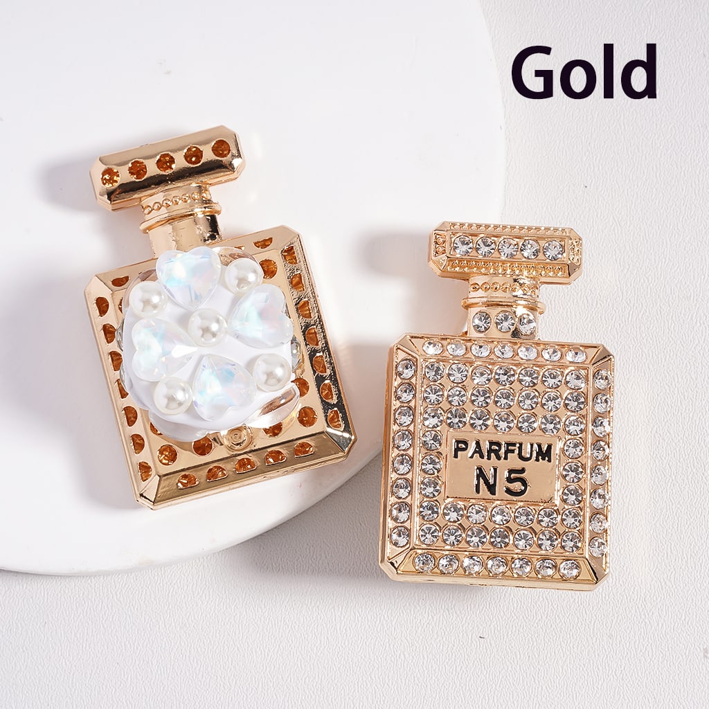 A collection of alloy bling bling parfum perfume bottles in various colors, each adorned with colorful shiny rhinestones, white pearls, and colorful hearts clay beads.