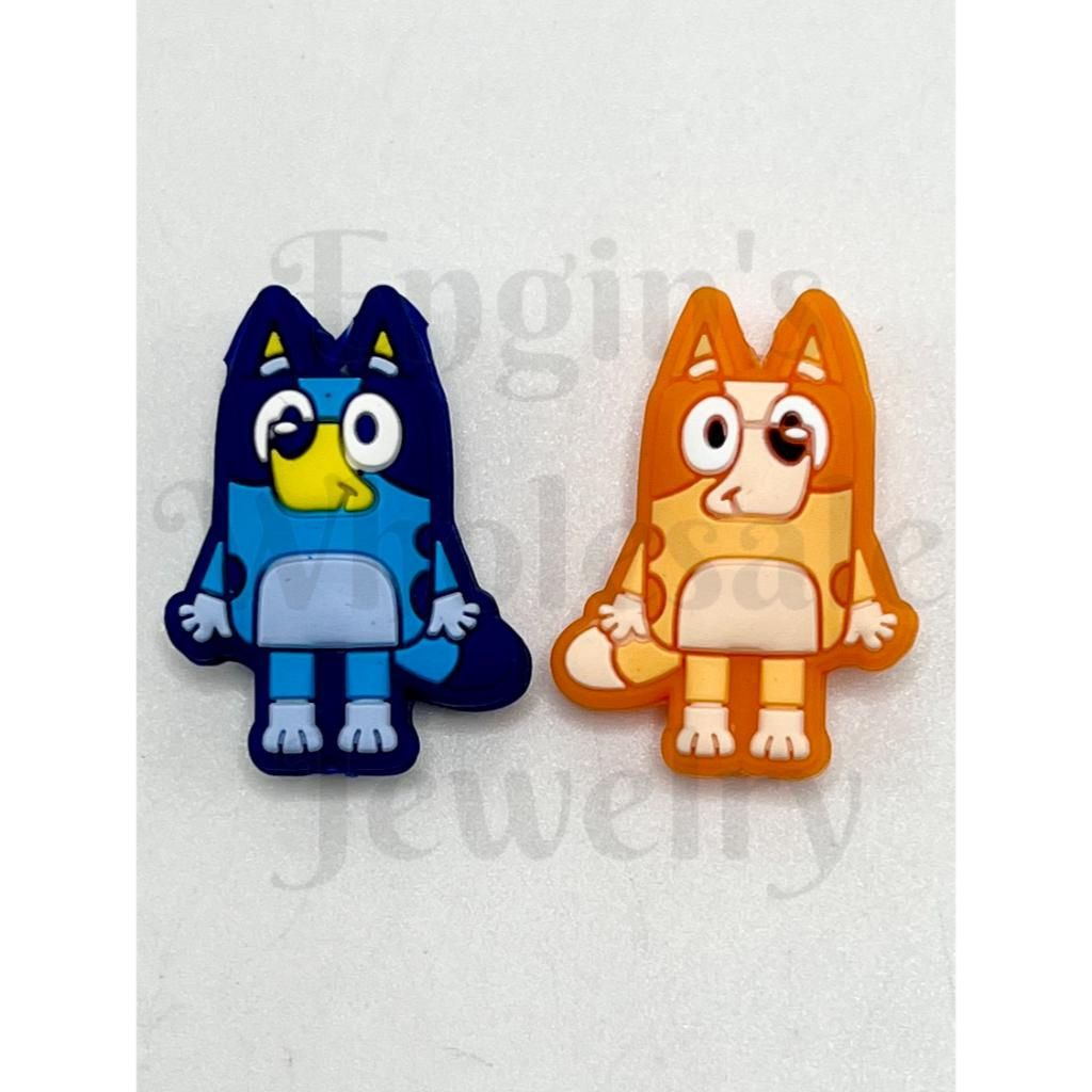 Two colorful cartoon character figures, one blue and one orange, on a light gray background.