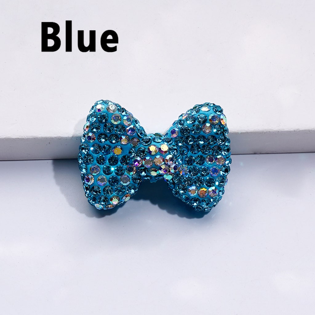 Blue rhinestone bow on a white background