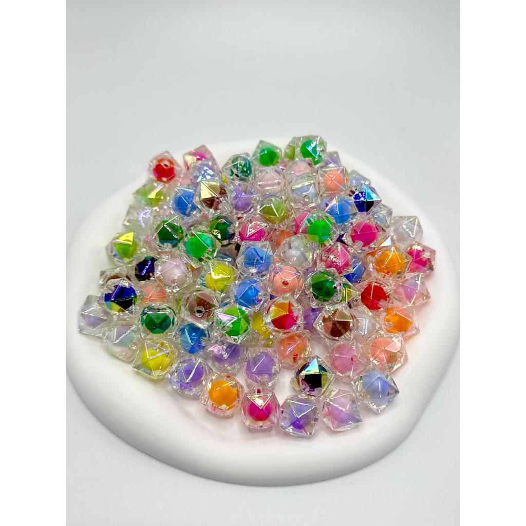 Multicolored crystal beads on a white plate