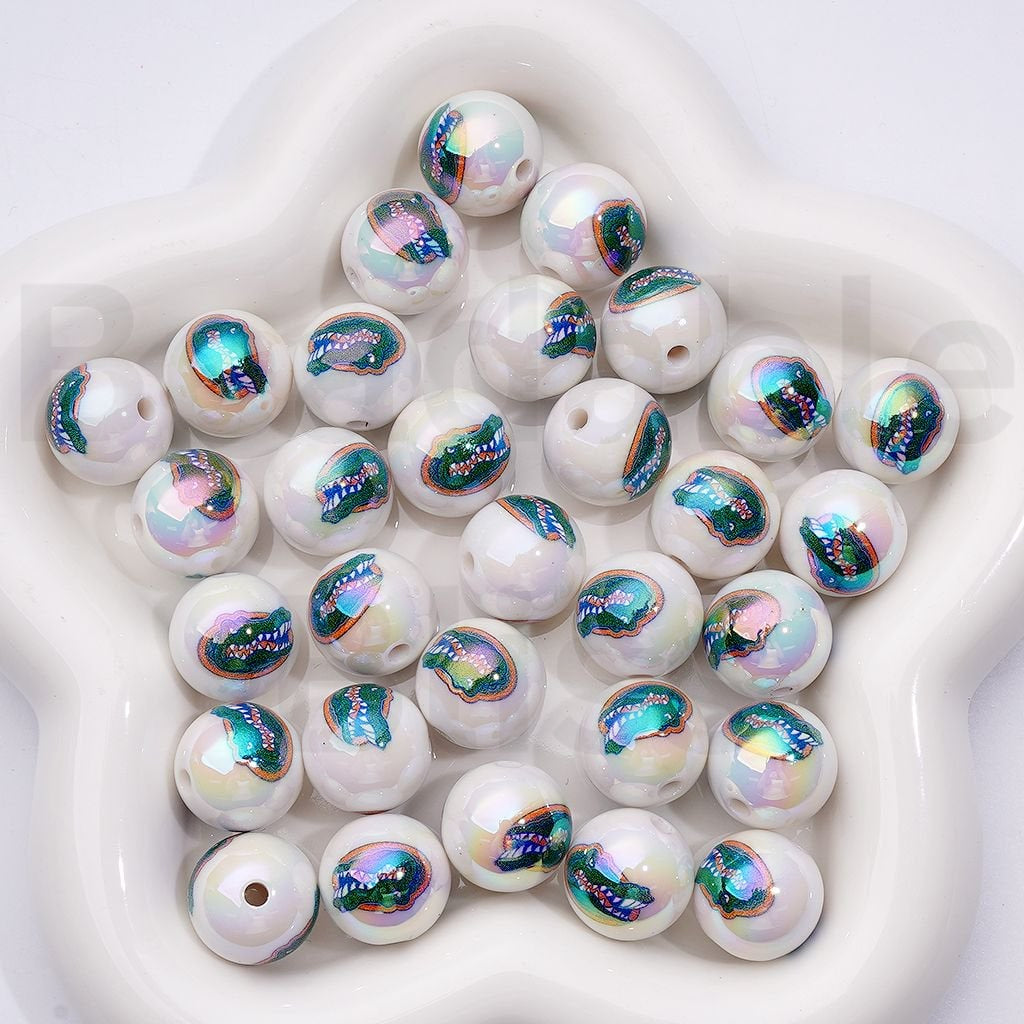 White beads with colorful mermaid scale patterns on a white background