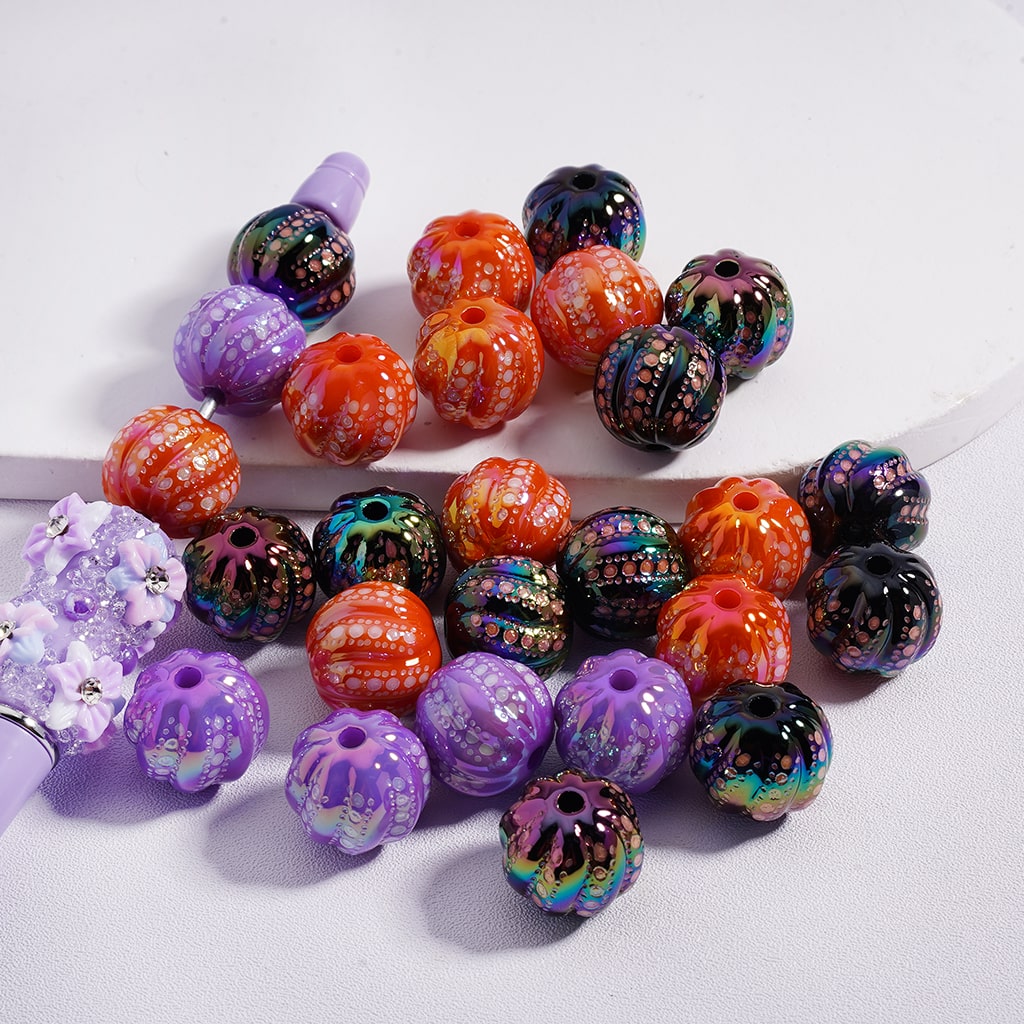 Assorted colorful beads on a white background