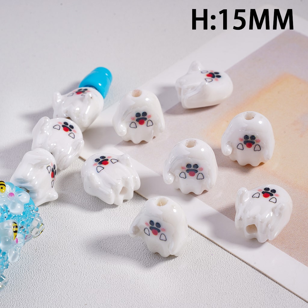 White dog-shaped beads with blue accents on a light gray background