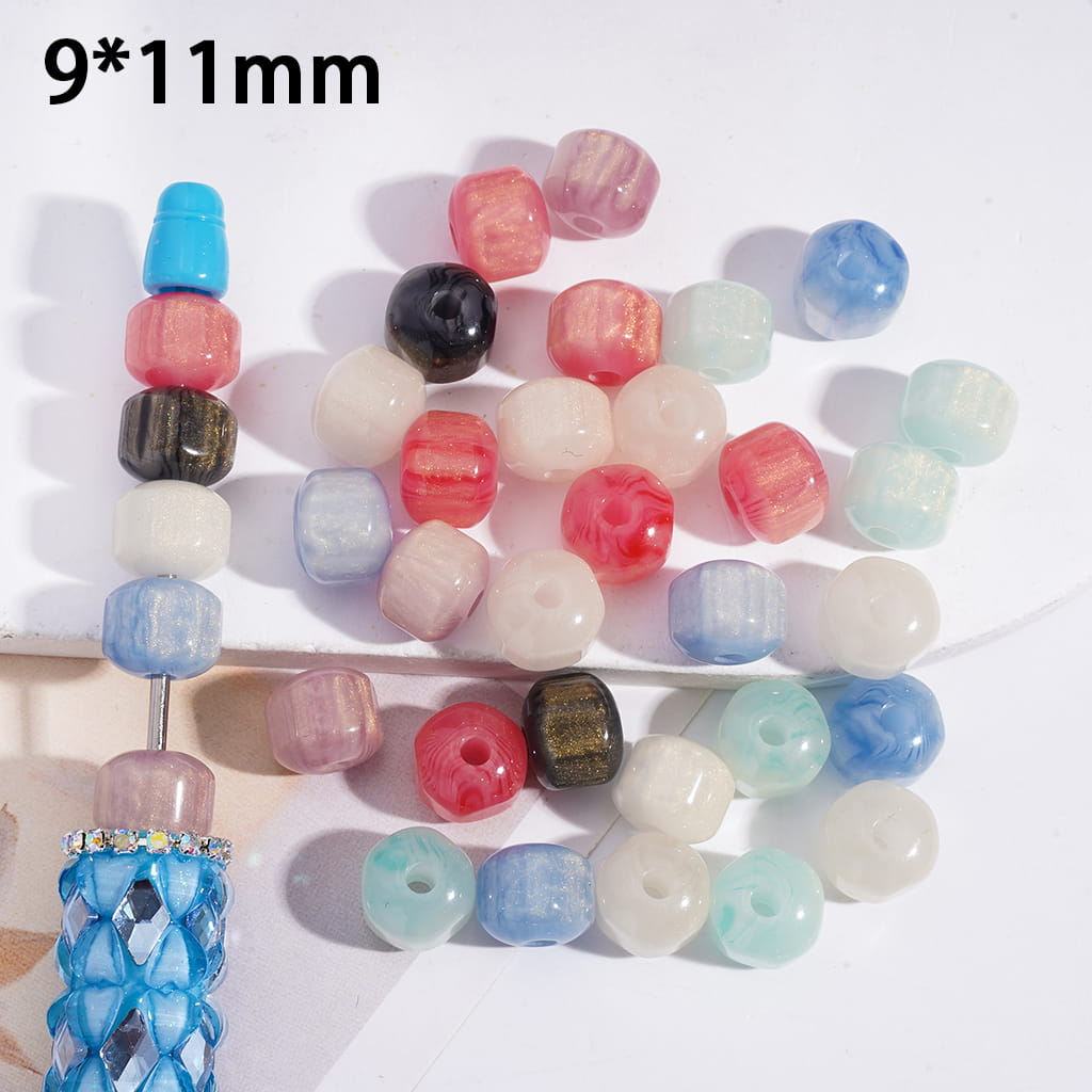 Colorful beads with a 9*11mm measurement on a white background