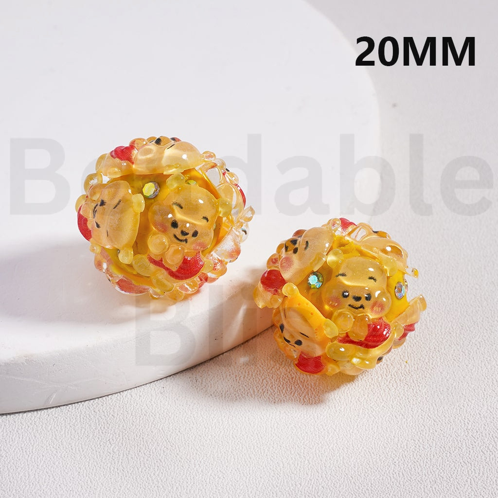 Two yellow character-themed hair rollers on a white surface with ' beadablebliss' branding.