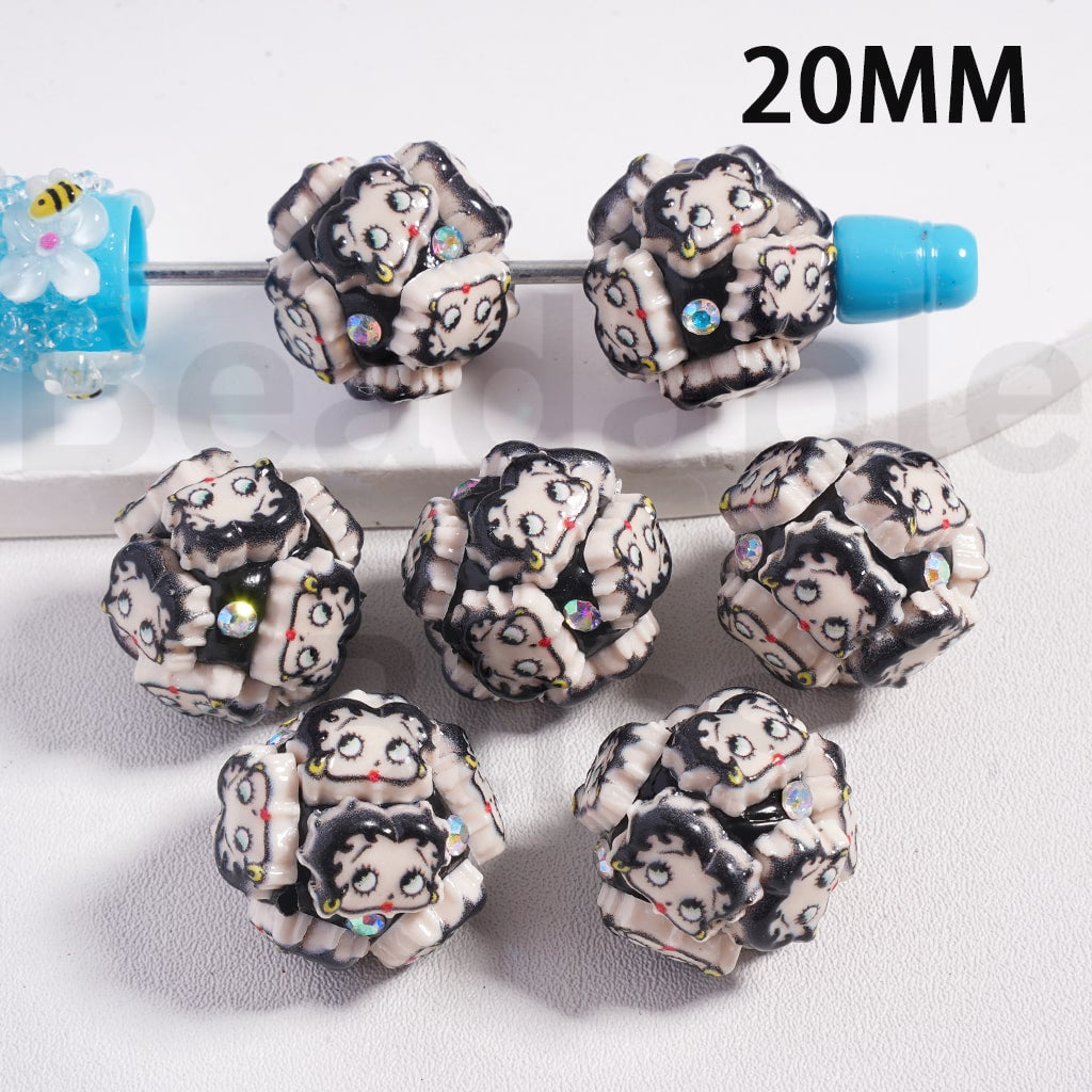 Decorative beads with cartoon character design on a white background