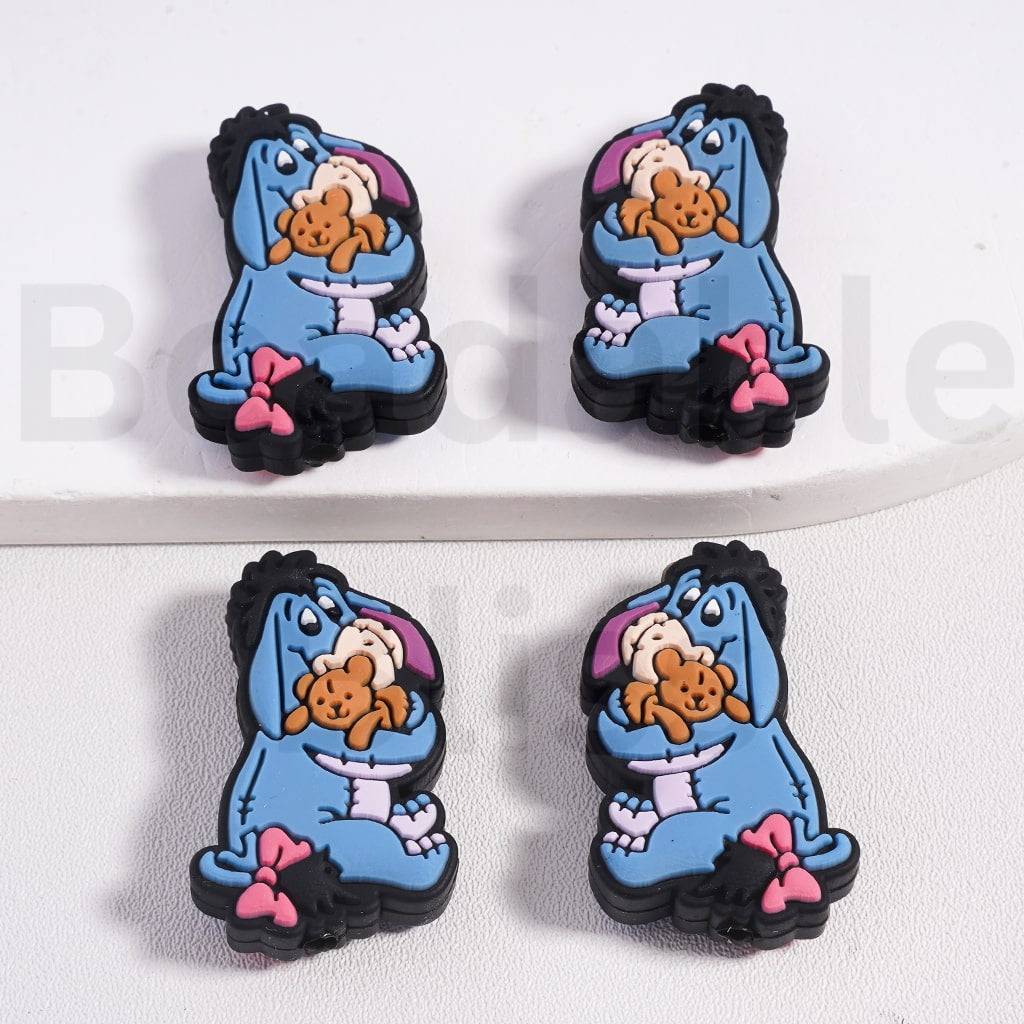 Set of four blue character earrings with a teddy bear on a white background