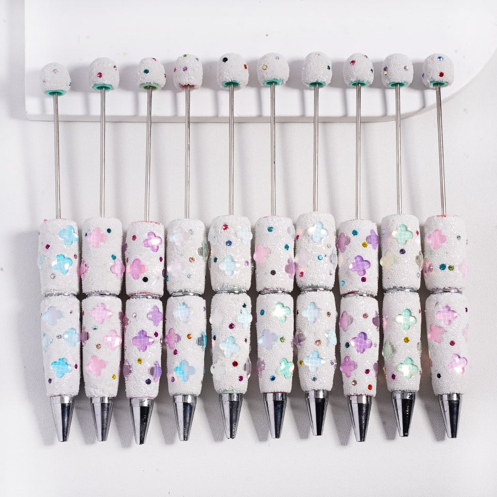 Set of pens with decorative handles on a white background