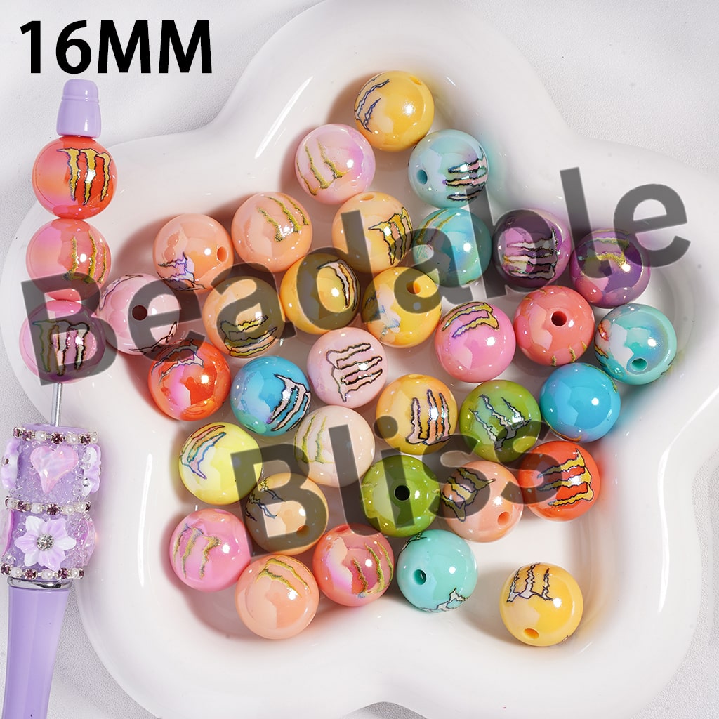 Assorted colorful beads on a white plate with a purple handle.