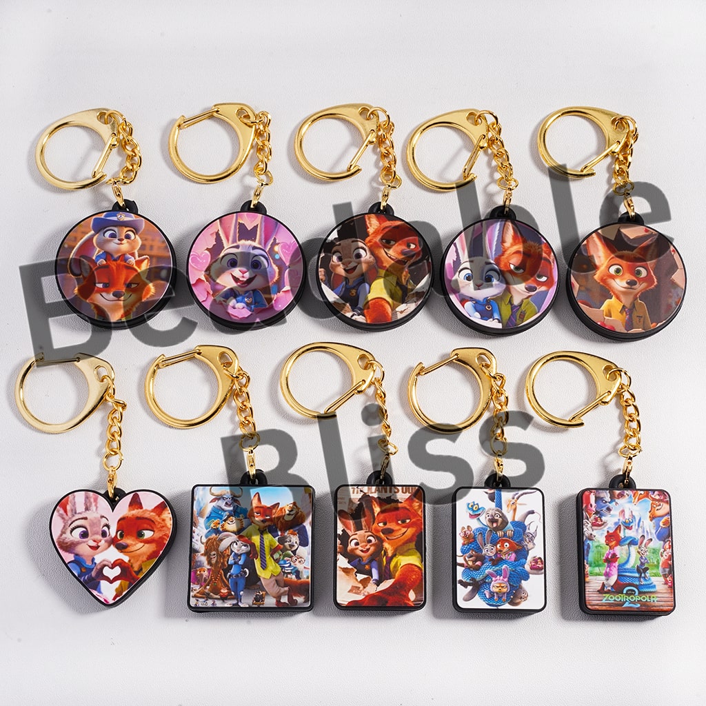 Collection of colorful keychains with cartoon characters on a white background