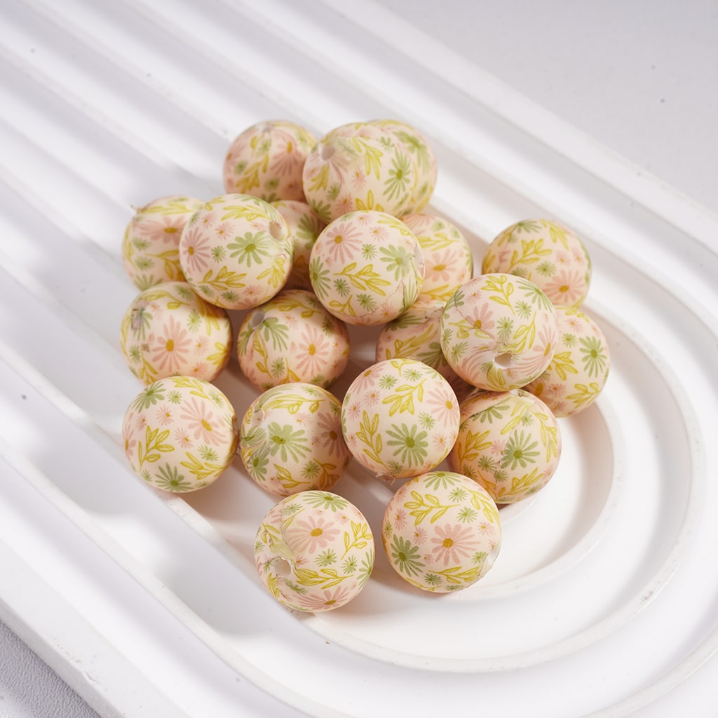 Decorative balls with floral patterns on a white plate