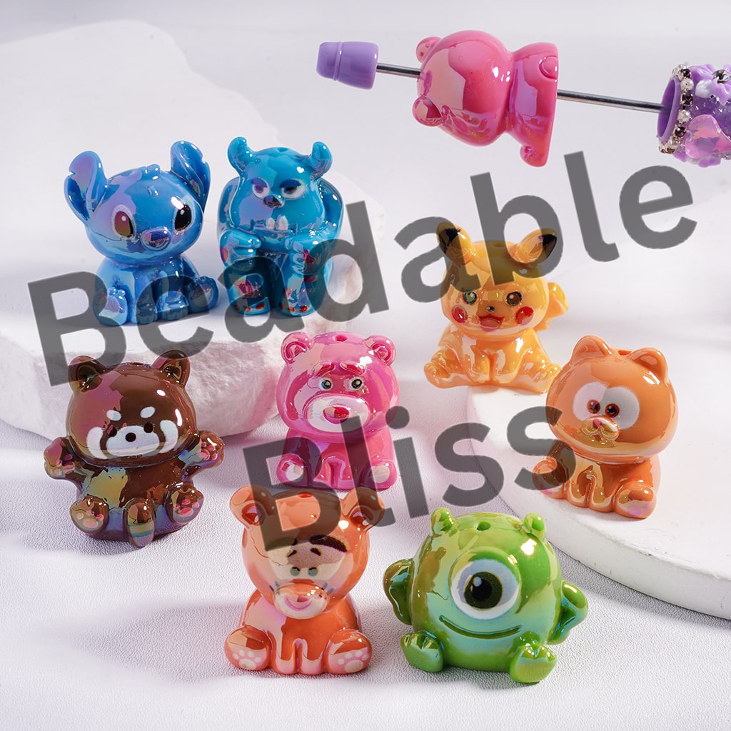 Colorful animal-shaped hair ties on a white background with 'beadablebliss' branding.