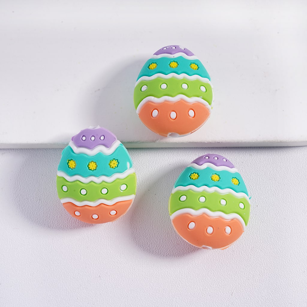 Colorful Easter egg-shaped cookies on a white background