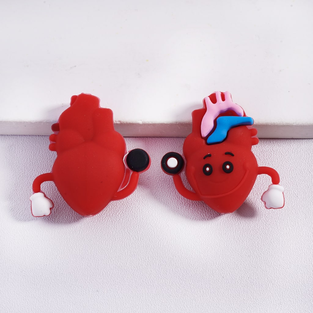 Two red heart-shaped characters with cartoon features on a white background
