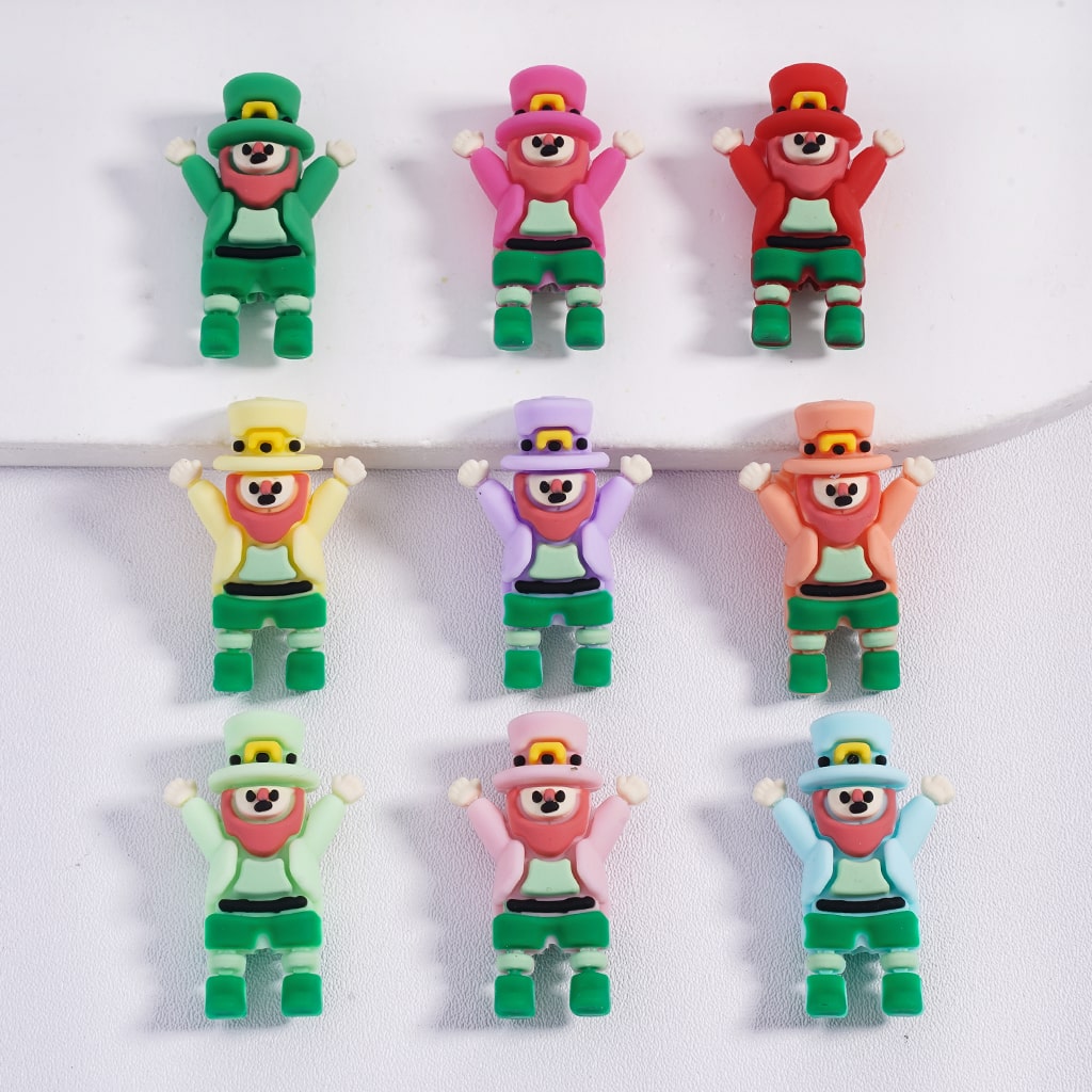 Set of colorful character figurines with green pants on a white background