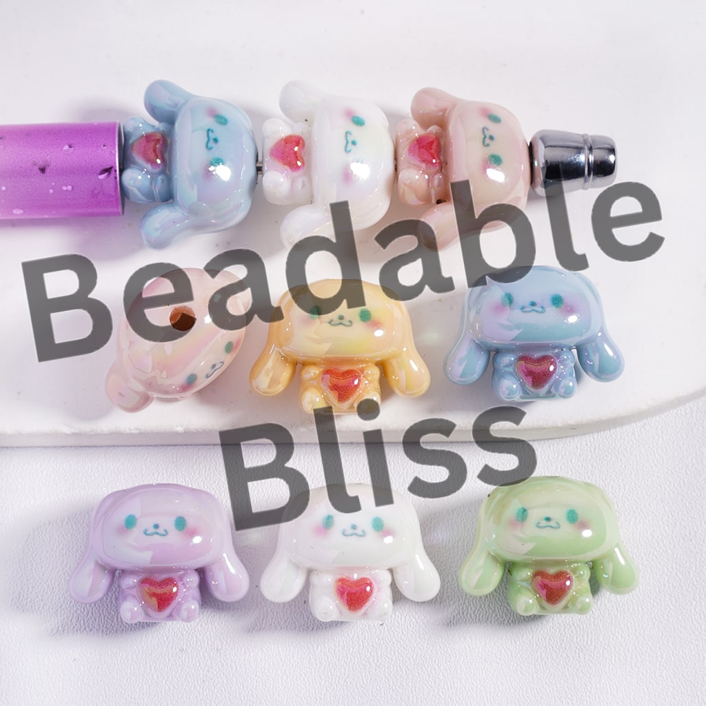 Colorful bead charms with 'Beadable Bliss' text on a white background