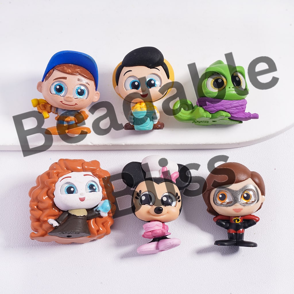 Set of colorful character figurines on a white background