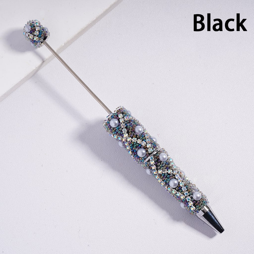 Decorative pen with gemstones on a light background