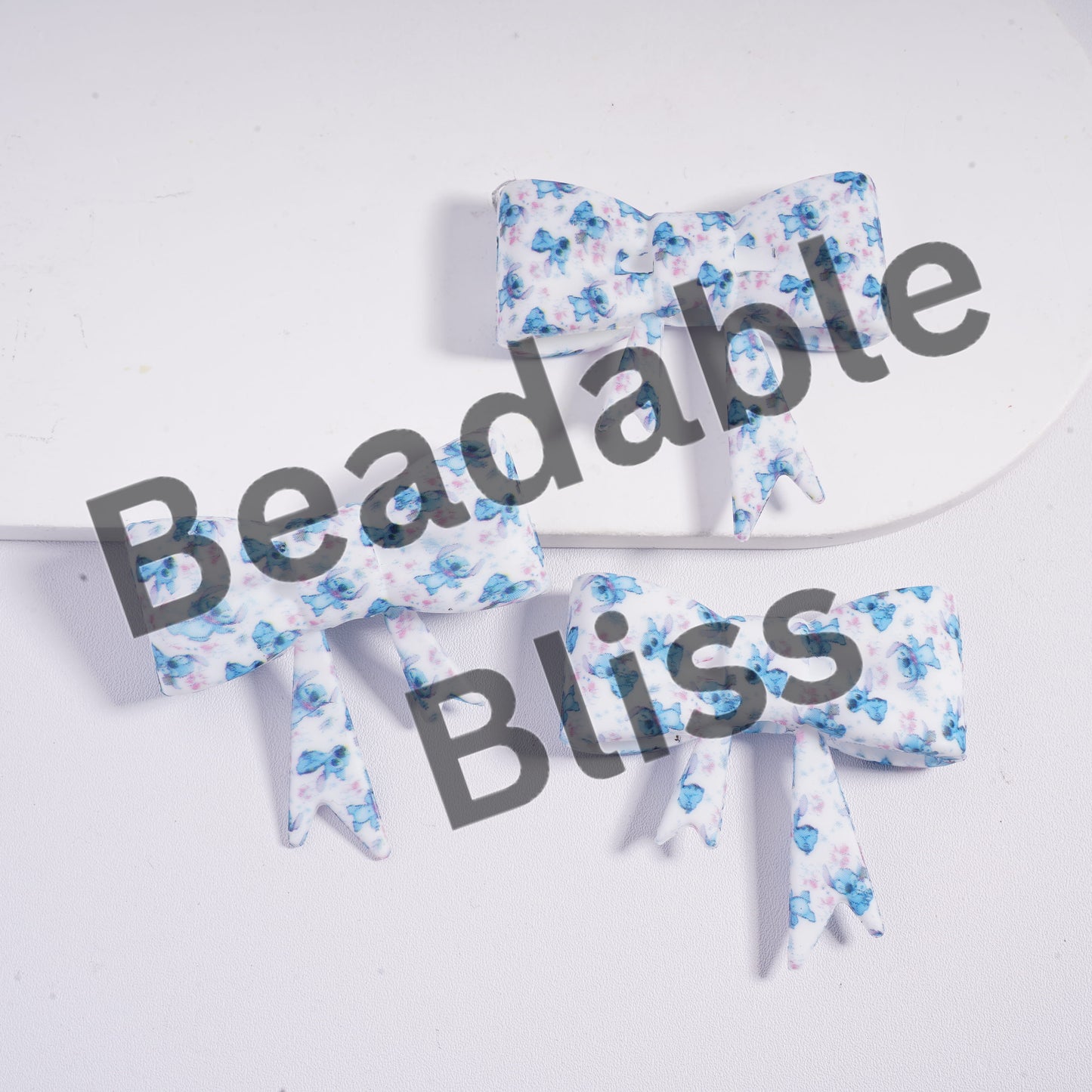 Floral-patterned bows on a white background with 'handsontosupply.com' text.