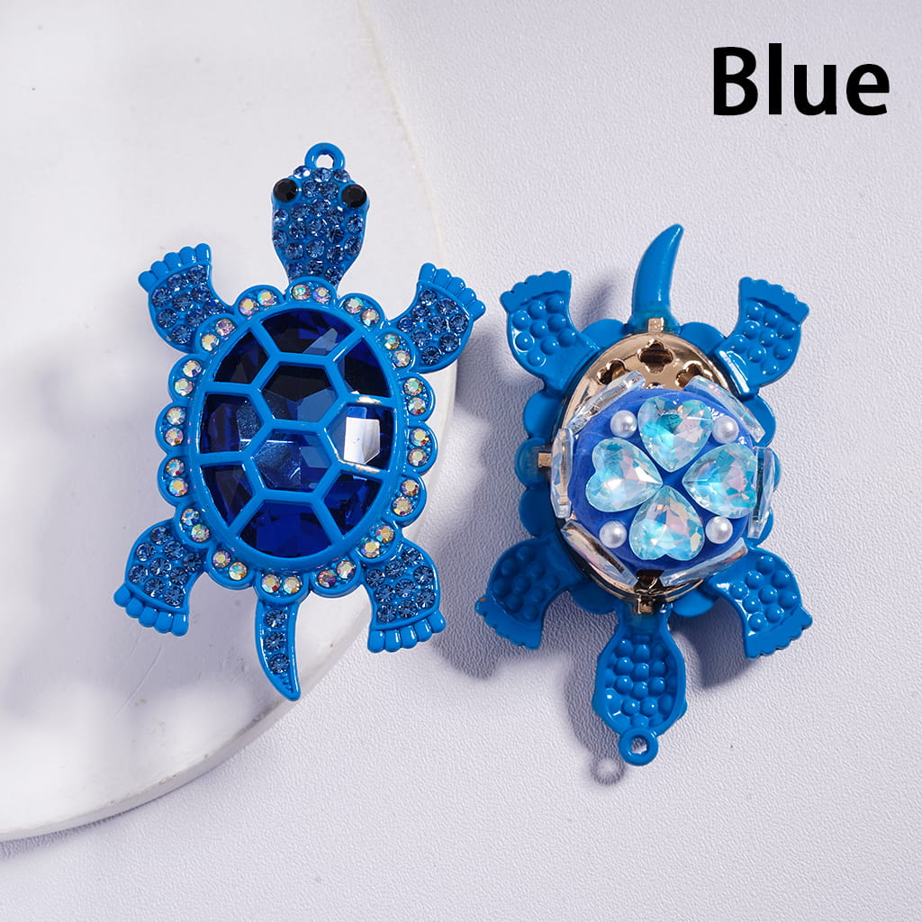 Blue turtle-shaped earrings on a white background with 'Blue' text.