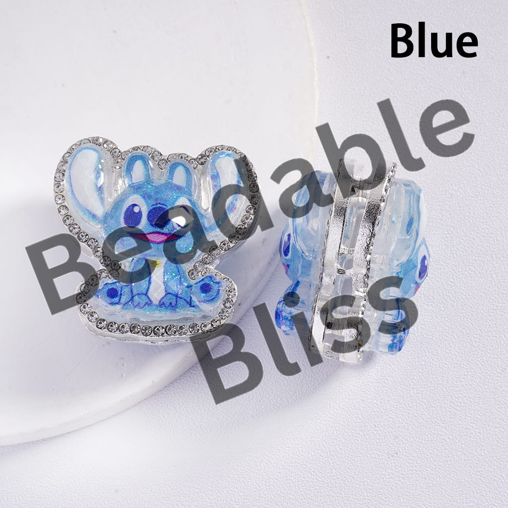 Blue bunny-shaped hair clip with rhinestones on a white background