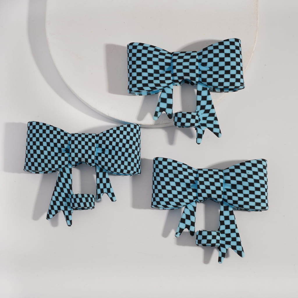 Set of blue and black checkered bows on a white background