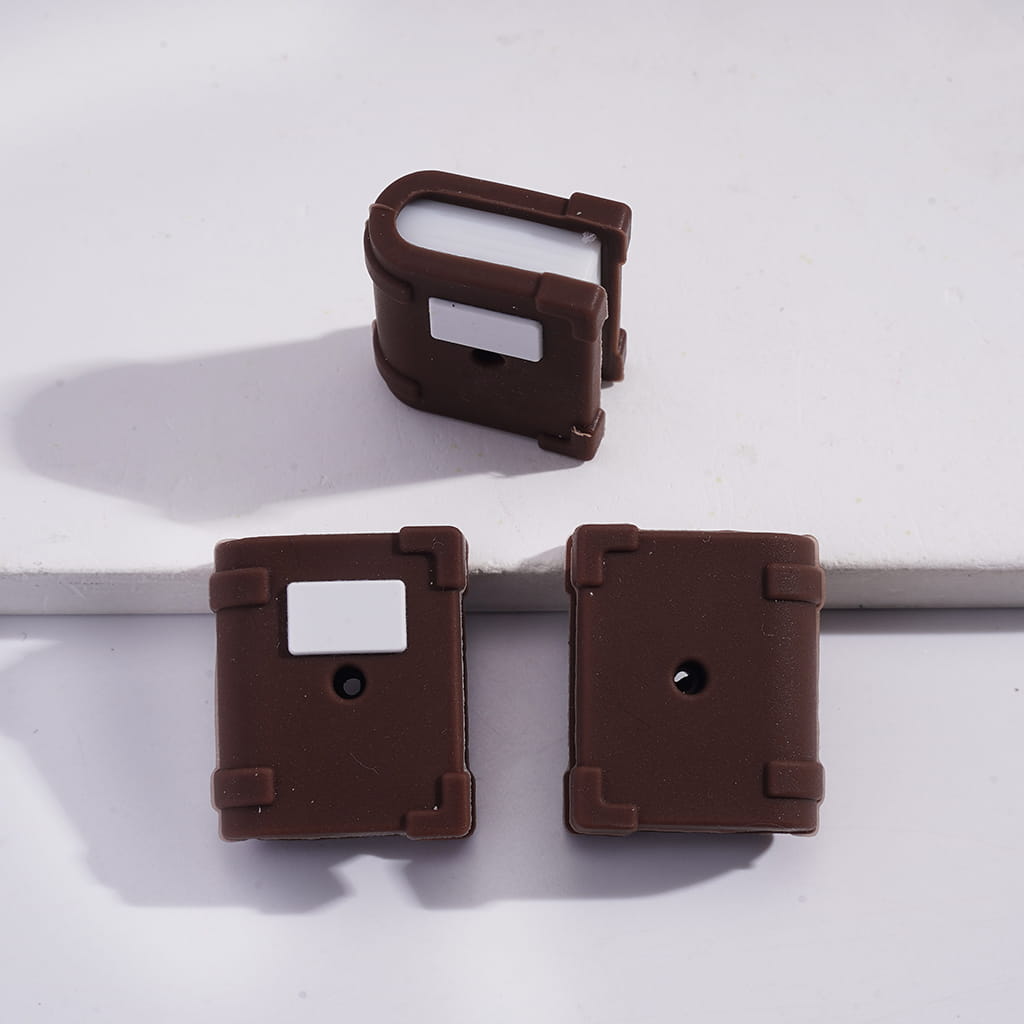 Three brown floppy disc-shaped objects on a white background
