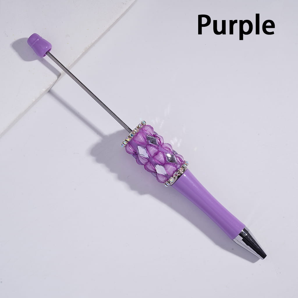 Purple pen with decorative top on a light gray background