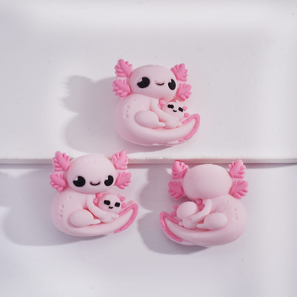 Three pink and white cartoon-like creatures with black eyes on a white background