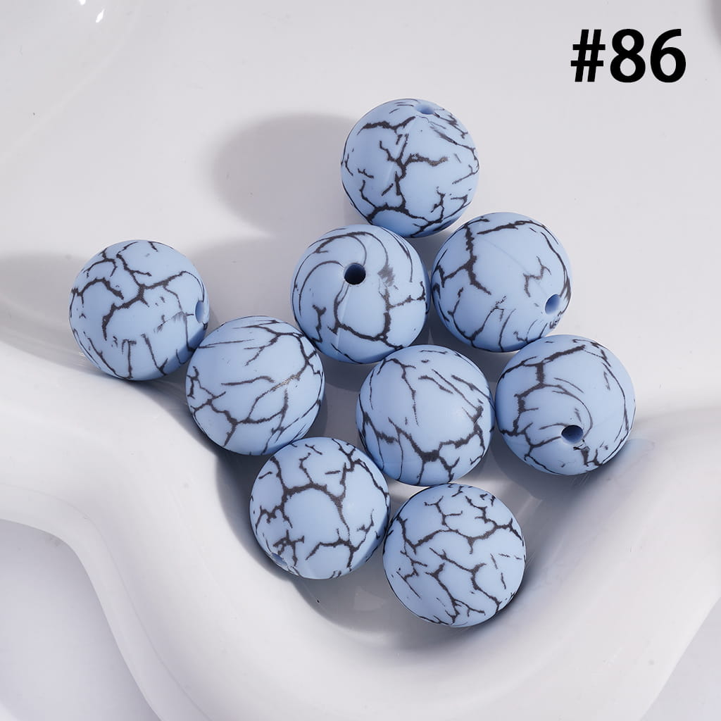 Blue marbled beads on a white background