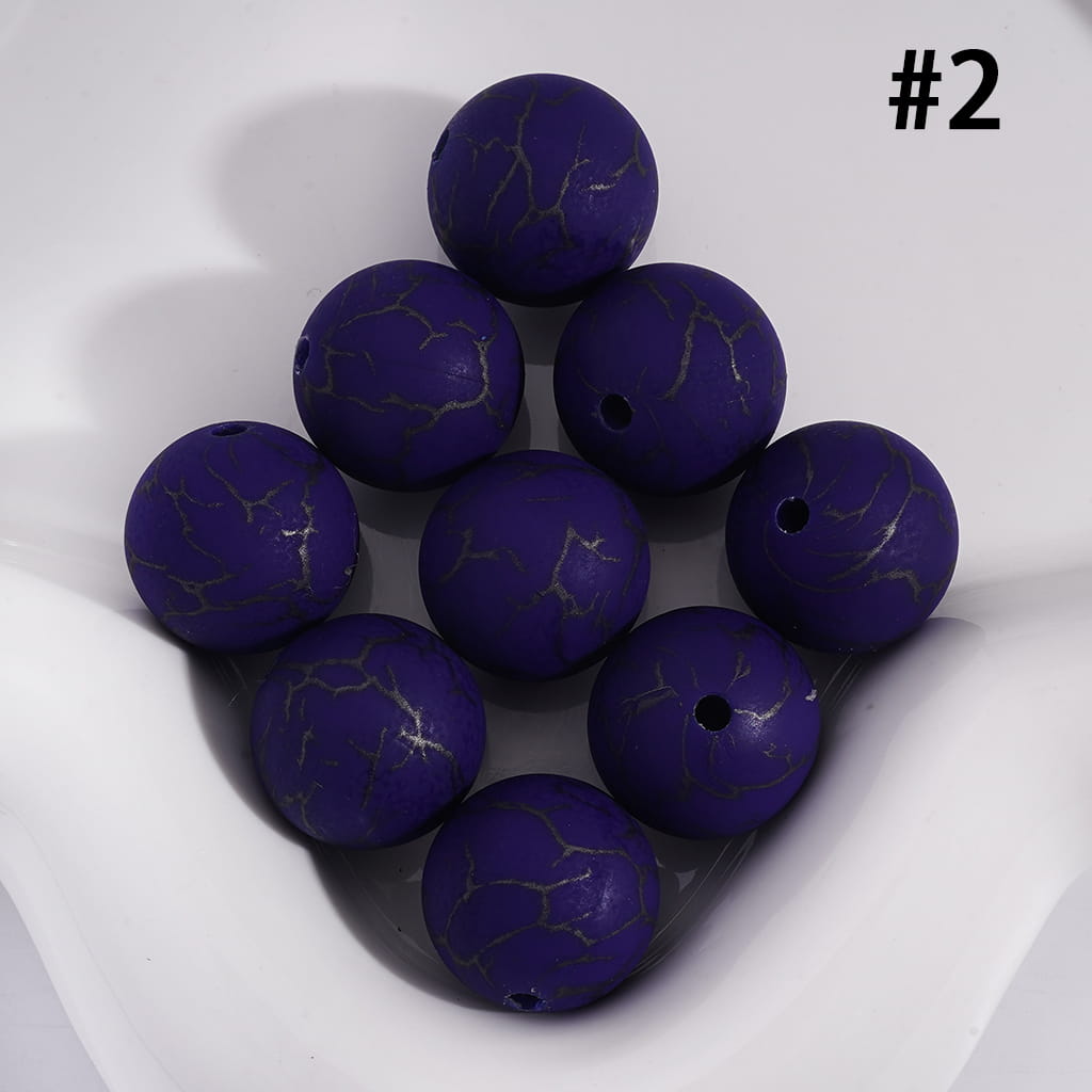 Purple marbled beads on a white surface