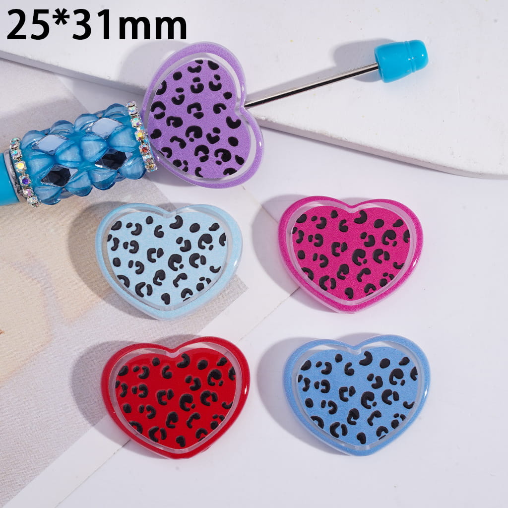 Heart-shaped clips with leopard print pattern in various colors on a white background.