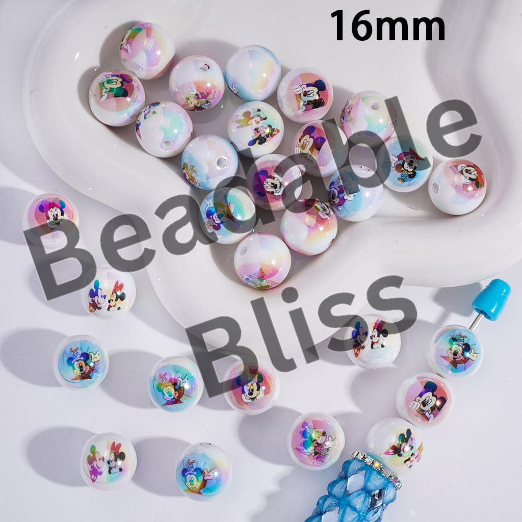 Colorful round charms with character designs arranged on a white surface, with 'handsontable.com' branding.