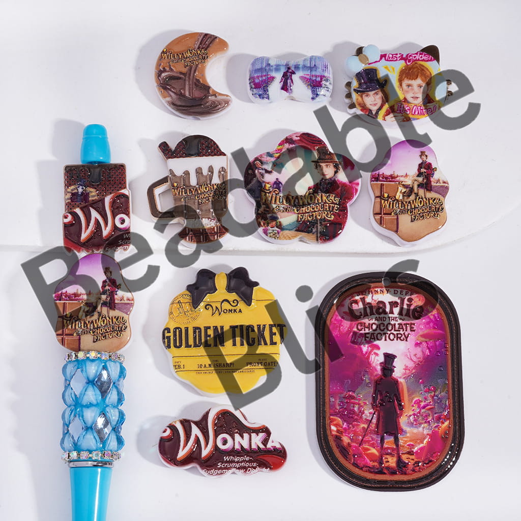 Collection of 'Charlie and the Chocolate Factory' themed merchandise on a white background.