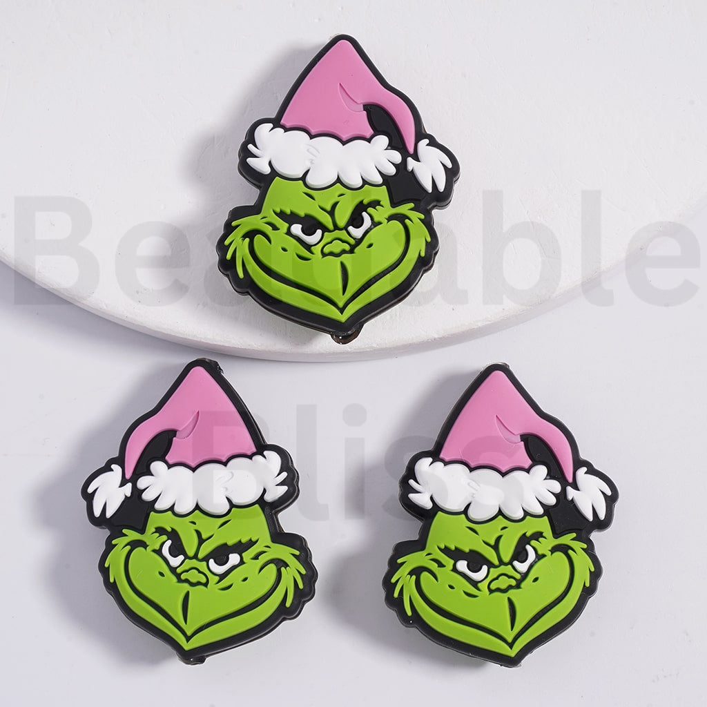 赤いクリスマス帽子のシリコーン焦点ビーズと漫画の緑のモンスター