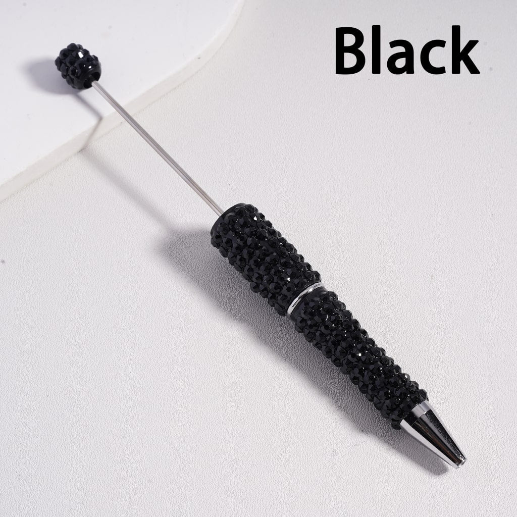 Black pen with decorative elements on a white background