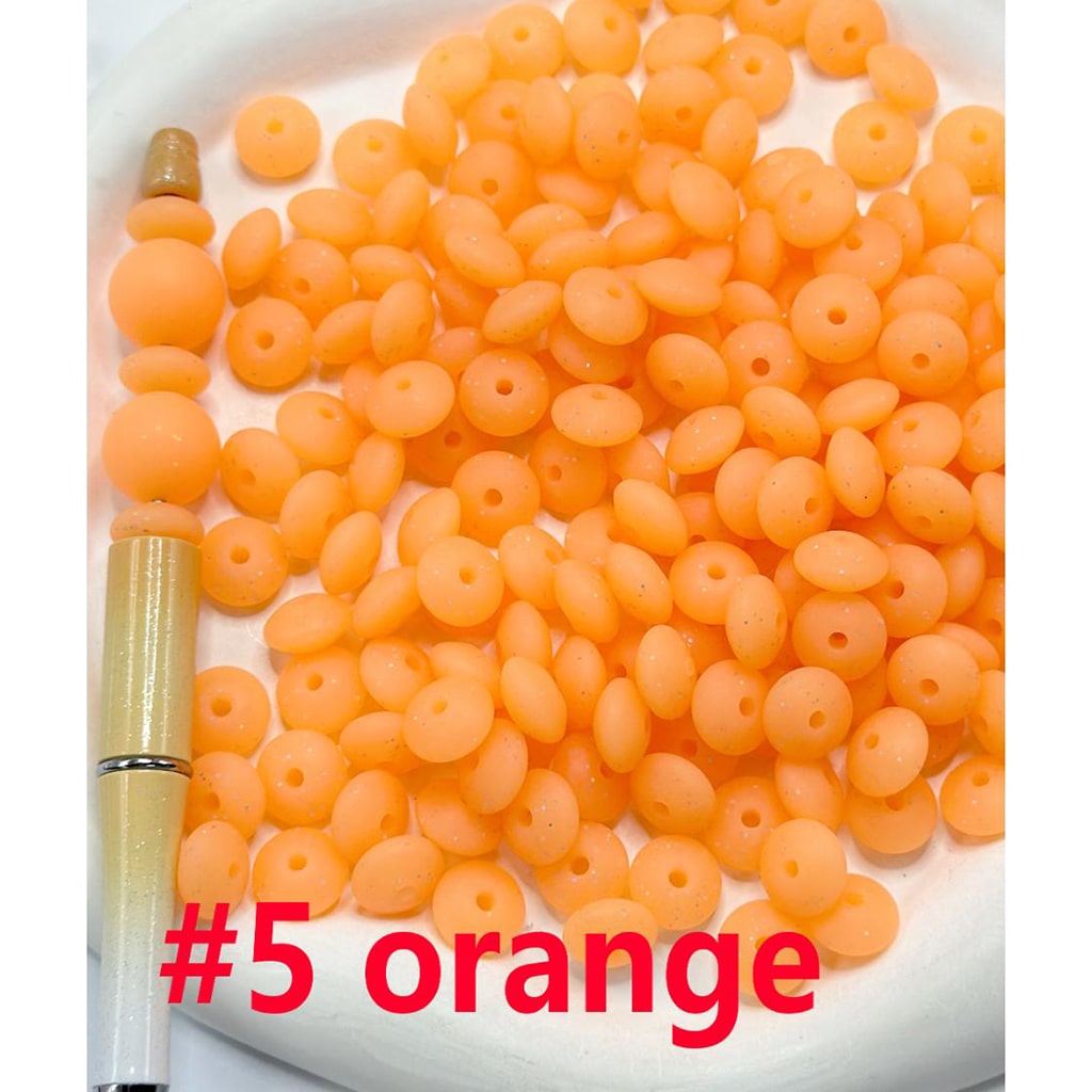 Orange beads on a white plate with a red label indicating '#5 orange'.