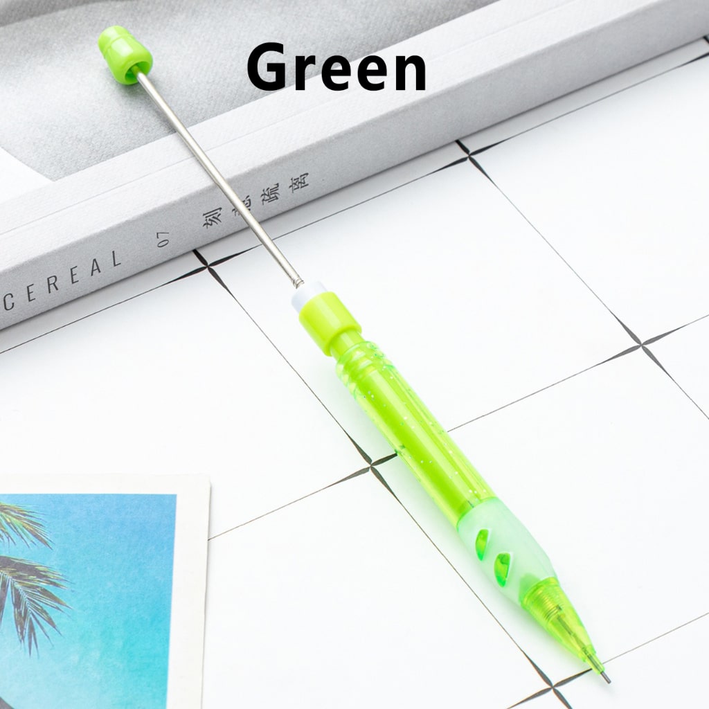 A collection of colorful mechanical pencils with beaded decorations on the barrel, displayed on a grid paper background.