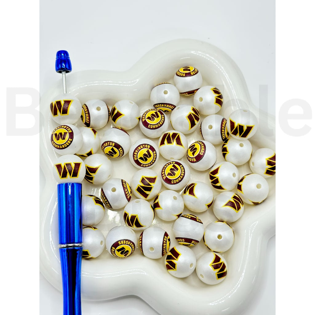 White beads with logos and a blue tool on a white background