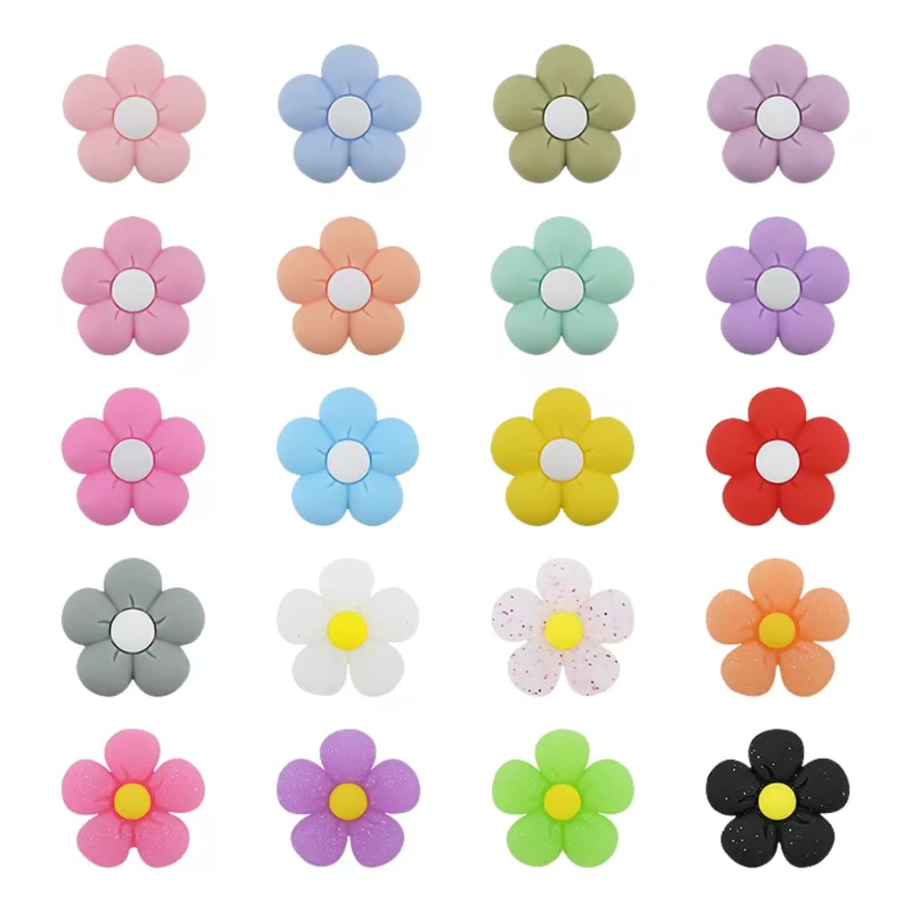 A collection of colorful silicone beads shaped like flowers, displayed in various colors.