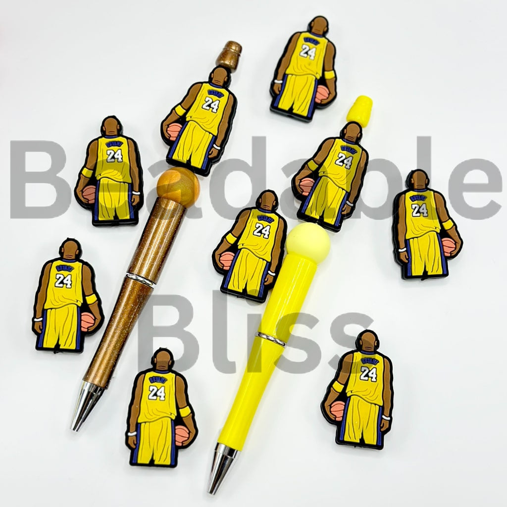 Two pens with basketball-themed figures on a white background