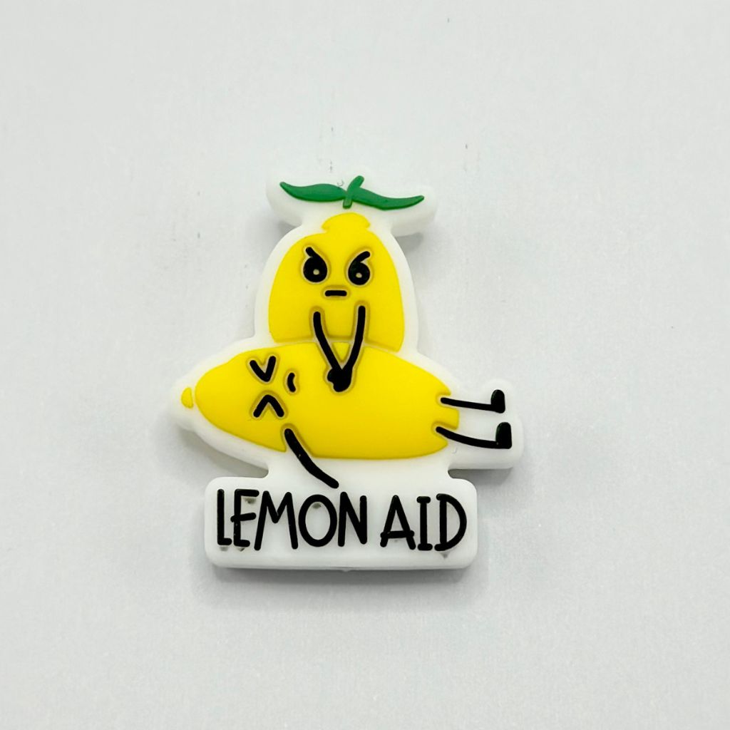A multicolored silicone bead pen with a design resembling a lemon and a character with the text 'LEMON AID'.