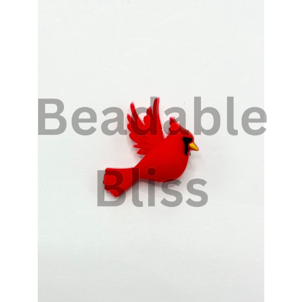 Red bird-shaped object on a white background with 'beadablebliss.com' text.