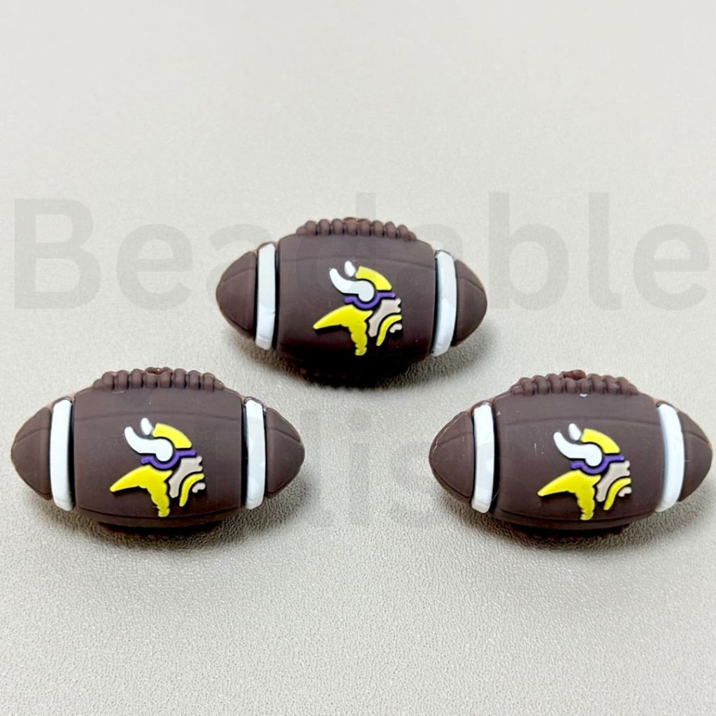 Three Minnesota Vikings football-shaped objects on a light gray background