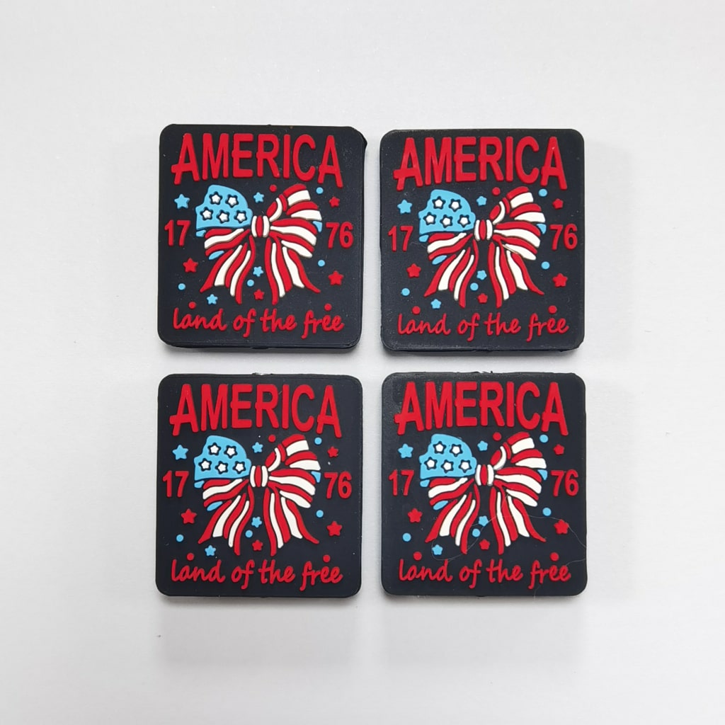 Four coasters with 'America' text and patriotic design on a white background