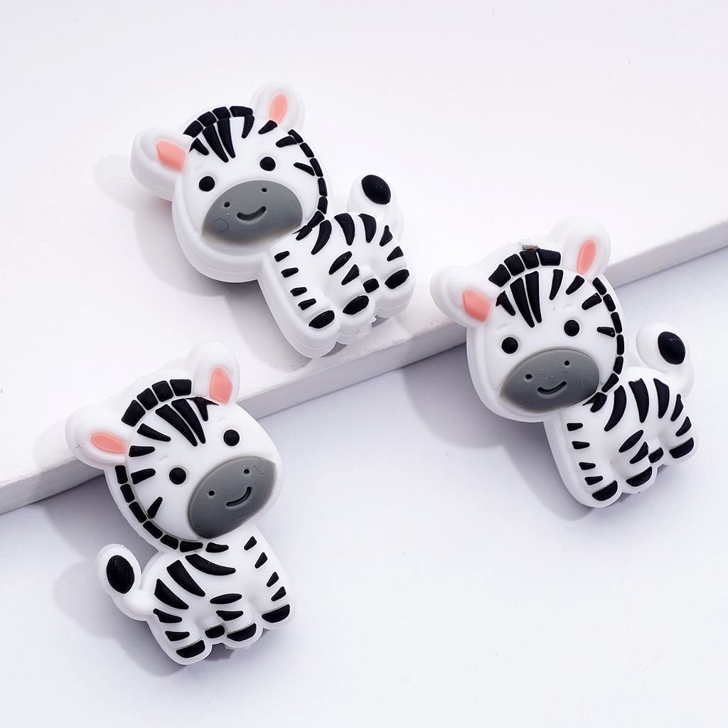Three zebra-shaped phone case holders on a white background